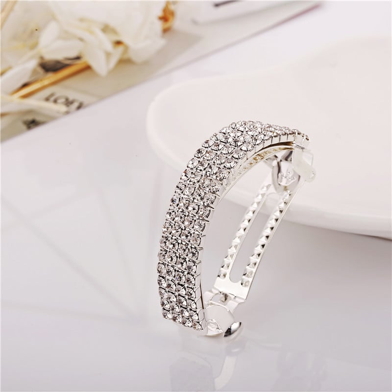 Diamond-encrusted hairpin at the back of the head for a stylish look