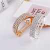 Diamond-encrusted hairpin at the back of the head for a stylish look
