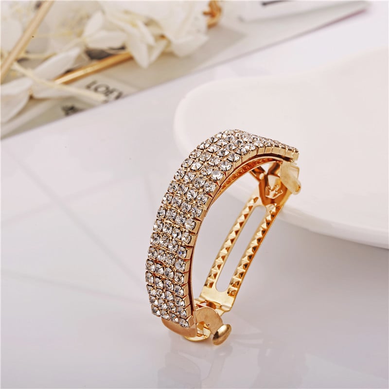 Diamond-encrusted hairpin at the back of the head for a stylish look