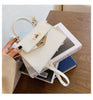 Carry a Kelly bag diagonally over one shoulder